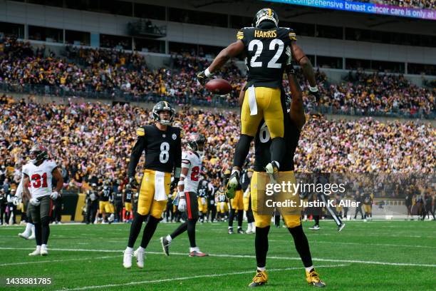 Najee Harris of the Pittsburgh Steelers celebrates with Dan Moore Jr. #65 and Kenny Pickett after scoring a touchdown during the first quarter...