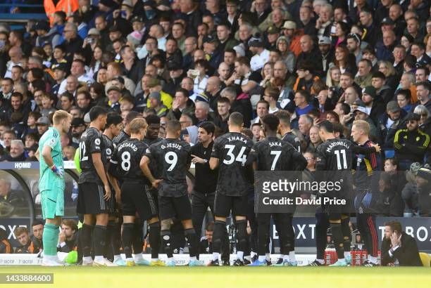 Arsenal Manager Mikel Arteta talks to his players during a break in play at the start of the match during the Premier League match between Leeds...
