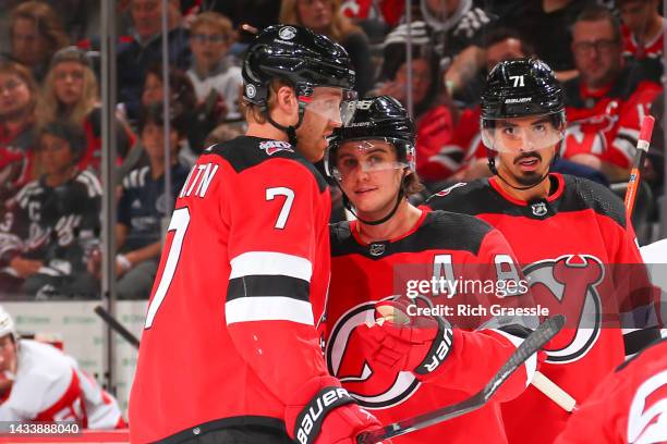 New Jersey Devils center Jack Hughes talks with New Jersey Devils defenseman Dougie Hamilton during the game against the Detroit Red Wings on October...