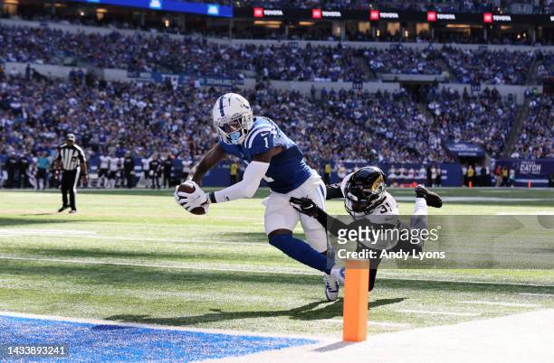 Parris Campbell of the Indianapolis Colts dives into the endzone for a touchdown against Darious Williams of the Jacksonville Jaguars during the...
