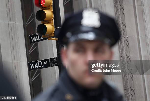 Police stand by as protesters march to Wall Street during an ACT-UP and Occupy Wall Street demonstration on April 25, 2012 in New York City. ACT-UP ,...