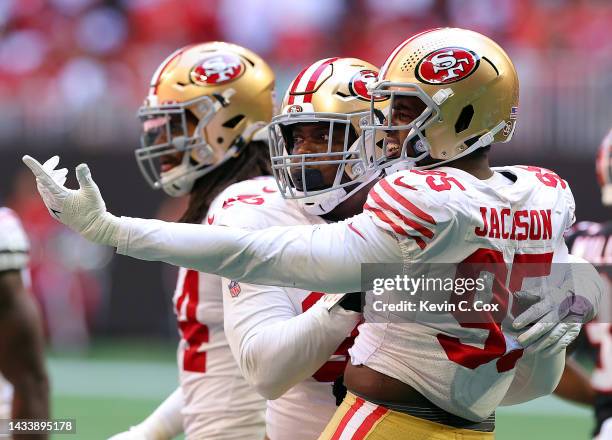 Kerry Hyder Jr. #92 of the San Francisco 49ers reacts with Drake Jackson after Jackson's sack during the second quarter against the Atlanta Falcons...