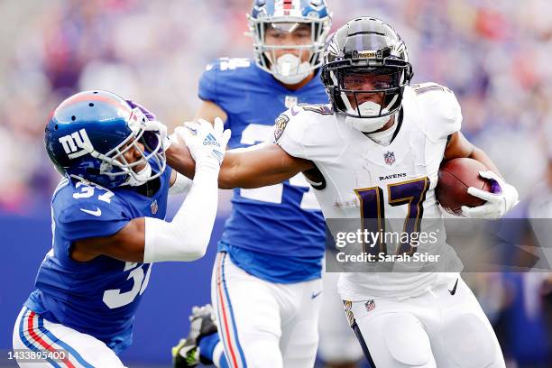 Kenyan Drake of the Baltimore Ravens runs the ball against Fabian Moreau of the New York Giants during the second quarter at MetLife Stadium on...