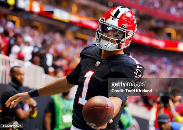 Marcus Mariota of the Atlanta Falcons reacts after scoring a touchdown during the second quarter at Mercedes-Benz Stadium on October 16, 2022 in...