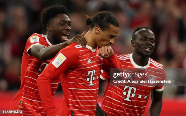 Leroy Sane of Bayern Munich celebrates with teammates after scoring their team's third goal during the Bundesliga match between FC Bayern München and...