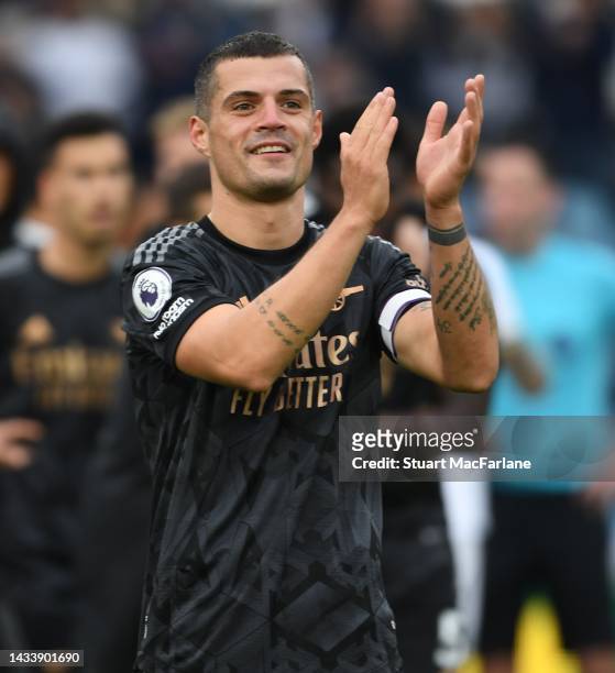 Granit Xhaka applauds the Arsenal fans after the Premier League match between Leeds United and Arsenal FC at Elland Road on October 16, 2022 in...