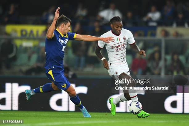 Rafael Leao of AC Milan is put under pressure by Giangiacomo Magnani of Hellas Verona during the Serie A match between Hellas Verona and AC MIlan at...
