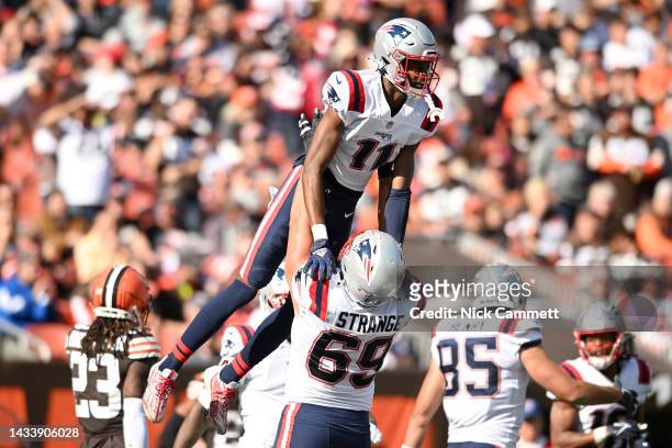 Cole Strange of the New England Patriots celebrates with Tyquan Thornton of the New England Patriots after Thornton's touchdown during the third...
