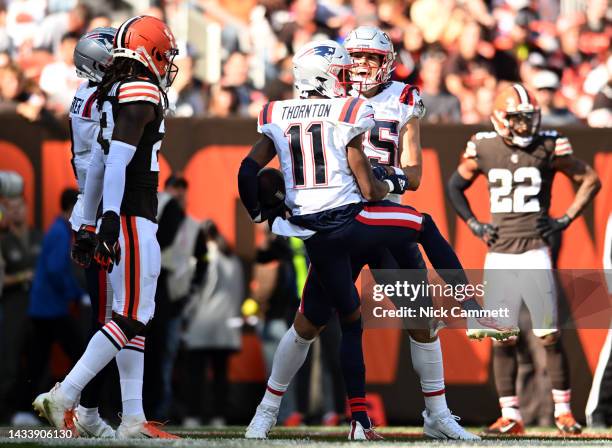 Tyquan Thornton of the New England Patriots celebrates with Hunter Henry of the New England Patriots after Thornton's touchdown during the third...