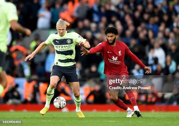 Joe Gomez of Liverpool competing with Erling Haaland of Manchester City during the Premier League match between Liverpool FC and Manchester City at...