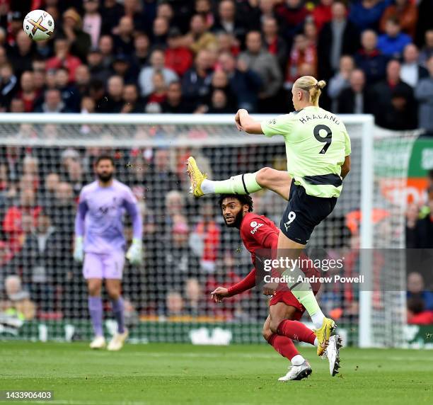 Joe Gomez of Liverpool competing with Erling Haaland of Manchester City during the Premier League match between Liverpool FC and Manchester City at...