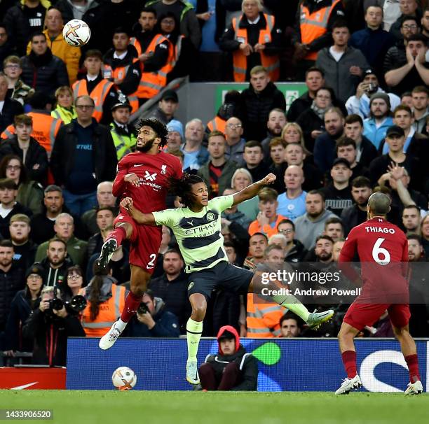 Joe Gomez of Liverpool goes up with Nathan Ake of Manchester City during the Premier League match between Liverpool FC and Manchester City at Anfield...