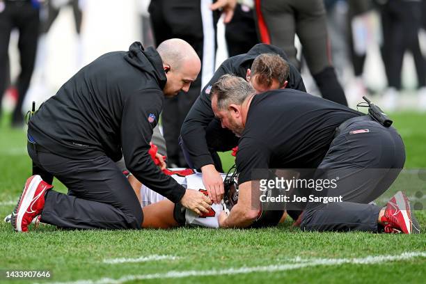 Cameron Brate of the Tampa Bay Buccaneers is looked over by trainers after an injury against the Pittsburgh Steelers during the fourth quarter at...