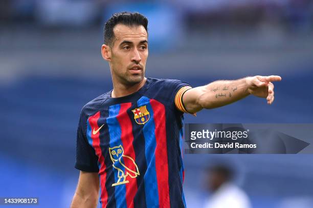 Sergio Busquets of FC Barcelona looks on wearing the modified OVO owl logo on the front of the FC Barcelona shirt, which celebrates Canadian musician...