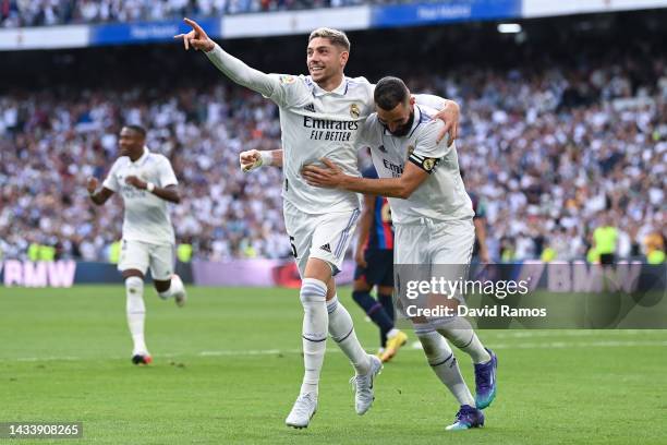 Federico Valverde of Real Madrid CF celebrates with his team mate Karim Benzema of Real Madrid CF after scoring his team's second goal during the...