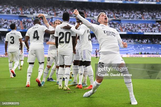 Federico Valverde of Real Madrid CF celebrates with his team mate Karim Benzema of Real Madrid CF after scoring his team's second goal during the...