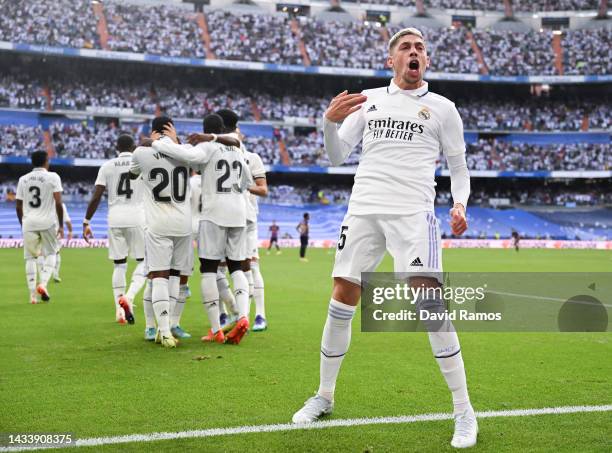 Federico Valverde of Real Madrid CF celebrates with his team mate Karim Benzema of Real Madrid CF after scoring his team's second goal during the...