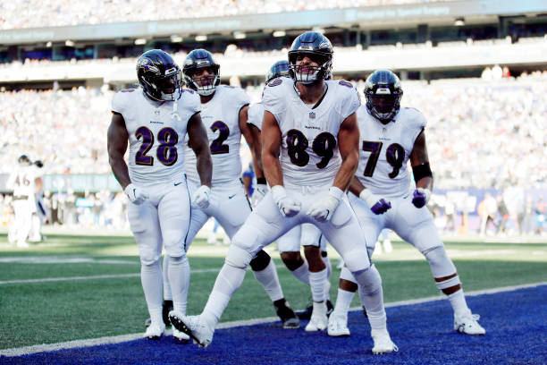 Mark Andrews of the Baltimore Ravens celebrates with teammates after catching a pass for a touchdown during the fourth quarter against the New York...