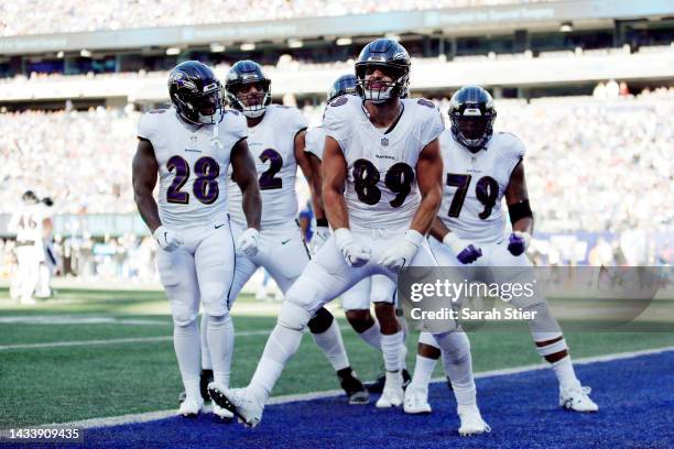 Mark Andrews of the Baltimore Ravens celebrates with teammates after catching a pass for a touchdown during the fourth quarter against the New York...