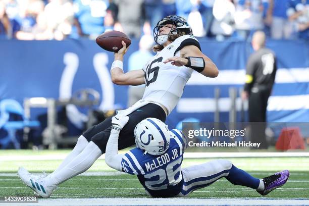 Trevor Lawrence of the Jacksonville Jaguars is tackled by Rodney McLeod of the Indianapolis Colts during the second half during the third quarter at...