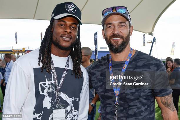 Las Vegas Raiders wide receiver Davante Adams, and former Vegas Golden Knights captain, Deryk Engelland pose for photos at the 1948 Club prior to the...