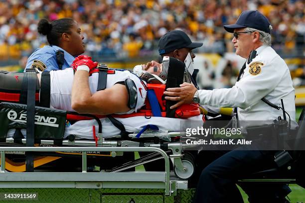 Cameron Brate of the Tampa Bay Buccaneers is taken off the field on a stretcher by the medical staff after being injured during the third quarter...