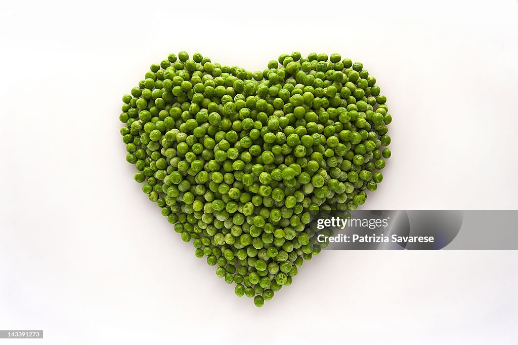 Heart-shaped formed by fresh Peas