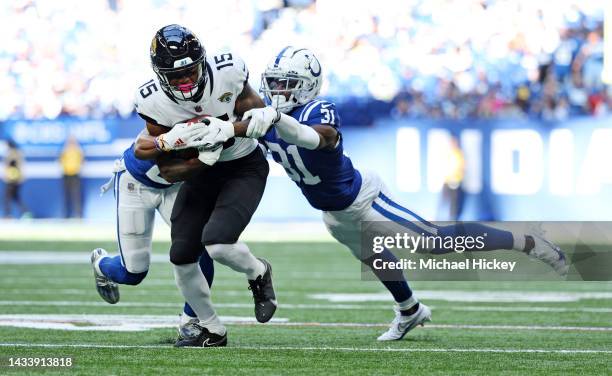 Tim Jones of the Jacksonville Jaguars is tackled by Brandon Facyson of the Indianapolis Colts during the second half at Lucas Oil Stadium on October...