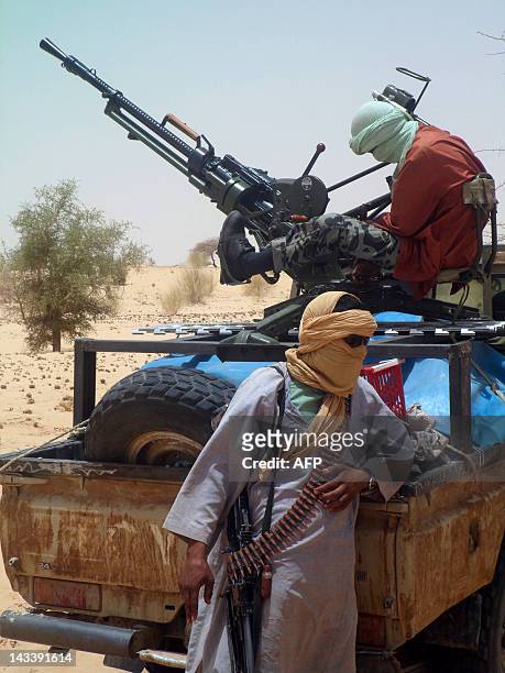Islamists rebels of Ansar Dine are pictured on April 24, 2012 near Timbuktu, rebel-held northern Mali, during the release of a Swiss hostage. Special...