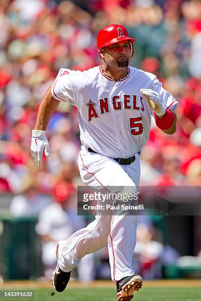 Albert Pujols of the Los Angeles Angels of Anaheim runs to first base as he grounds out for the final out in the bottom of the first inning during...