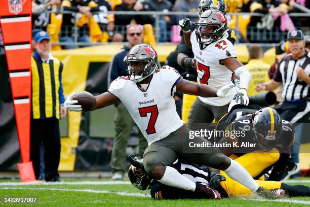 Leonard Fournette of the Tampa Bay Buccaneers scores a touchdown during the fourth quarter against the Pittsburgh Steelers at Acrisure Stadium on...