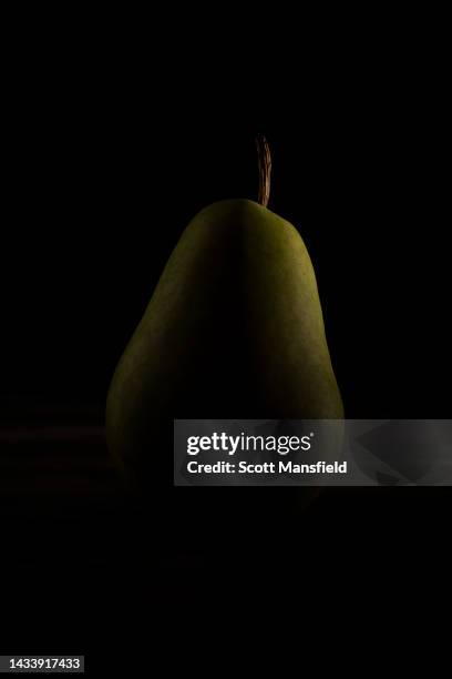 dramatic portrait of a green pear - rim light portrait stock pictures, royalty-free photos & images