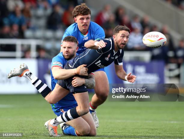 Ryan Brierley of Scotland is tackled by Nathan Brown of Italy during Rugby League World Cup 2021 Pool B match between Scotland and Italy at Kingston...