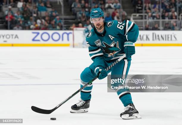 Erik Karlsson of the San Jose Sharks looks to pass the puck against the Chicago Blackhawks during the second period of an NHL Hockey game at SAP...