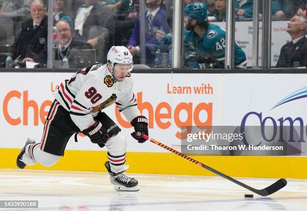 Tyler Johnson of the Chicago Blackhawks skates up ice with control of the puck against the San Jose Sharks in the third period of an NHL Hockey game...