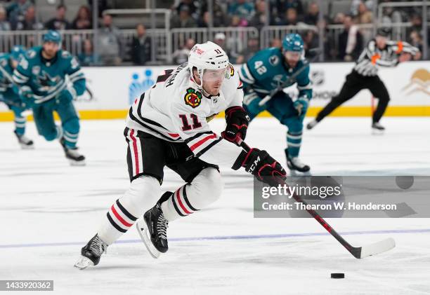 Taylor Raddysh of the Chicago Blackhawks skates up ice with control of the puck against the San Jose Sharks in the third period of an NHL Hockey game...