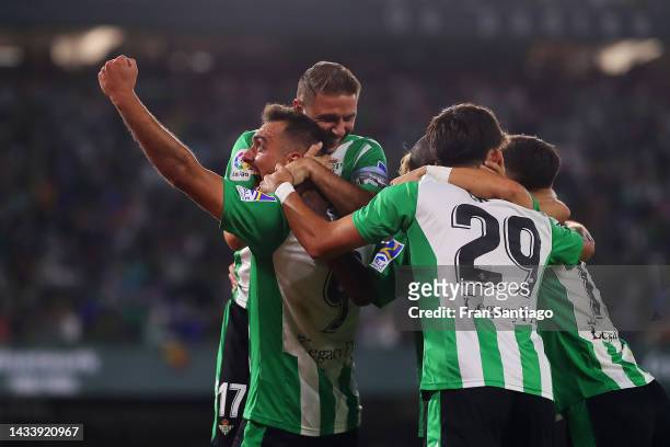 Borja Iglesias of Real Betis celebrates with teammates after scoring their team's second goal during the LaLiga Santander match between Real Betis...