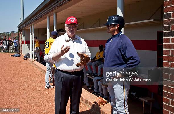 Republican presidential candidate, former Speaker of the House Newt Gingrich talks with the North Carolina A&T State University coach prior to...