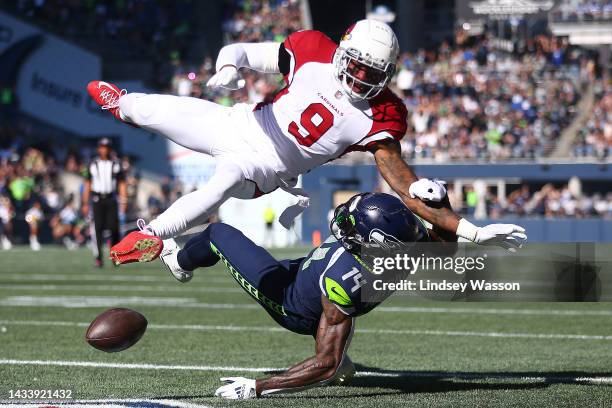 Isaiah Simmons of the Arizona Cardinals breaks u[p a pass intended for DK Metcalf of the Seattle Seahawks during the first quarter at Lumen Field on...