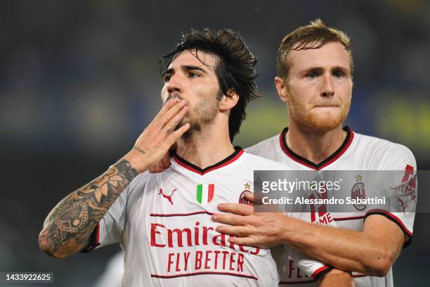 Sandro Tonali of AC Milan celebrates with teammate Tommaso Pobega after scoring their team's second goal during the Serie A match between Hellas...