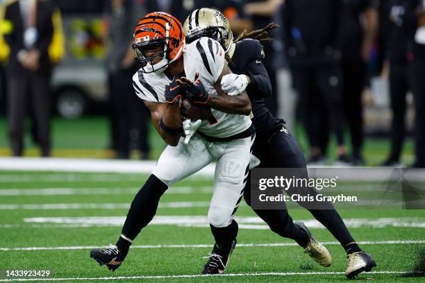 Ja'Marr Chase of the Cincinnati Bengals is tackled by Bradley Roby of the New Orleans Saints during the second half at Caesars Superdome on October...