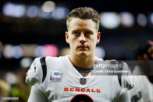 Joe Burrow of the Cincinnati Bengals walks off the field after defeating the New Orleans Saints 30-26 at Caesars Superdome on October 16, 2022 in New...