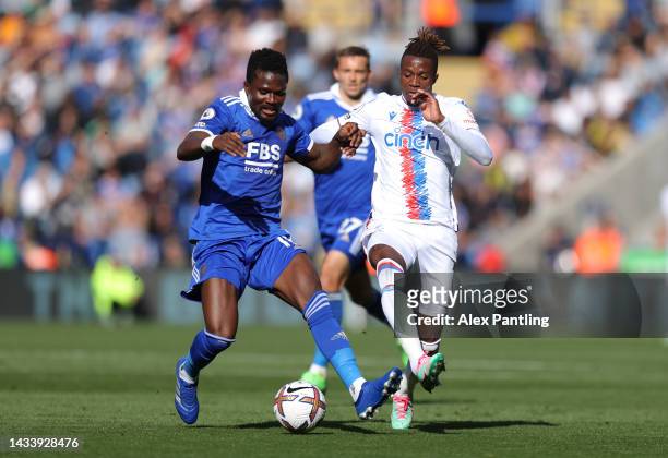 Daniel Amartey of Leicester City holds possession from Wilfred Zaha of Crystal Palace during the Premier League match between Leicester City and...