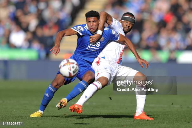 James Justin of Leicester City is tackled by Jordan Ayew of Crystal Palace during the Premier League match between Leicester City and Crystal Palace...