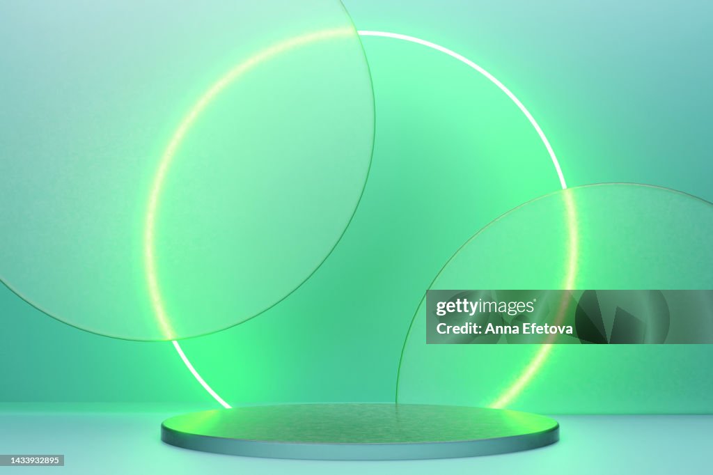 Black marble podium with green neon circles and matt glass on background