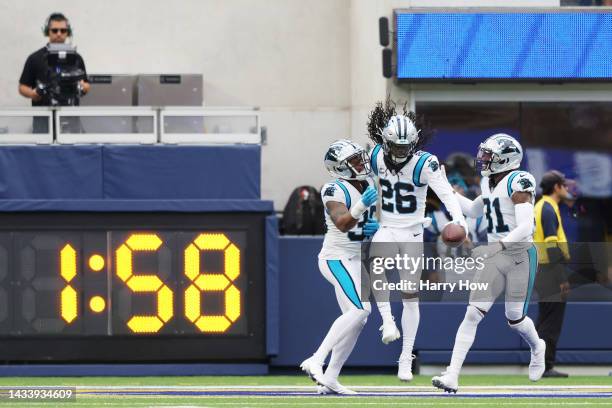 Donte Jackson of the Carolina Panthers celebrates with Myles Hartsfield of the Carolina Panthers and Juston Burris of the Carolina Panthers celebrate...