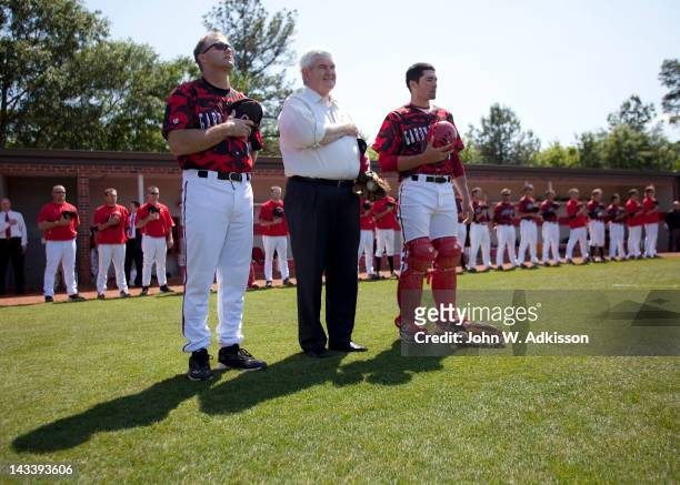 Republican presidential candidate, former Speaker of the House Newt Gingrich stands with Gardner-Webb University baseball coach Rusty Stroupe and...