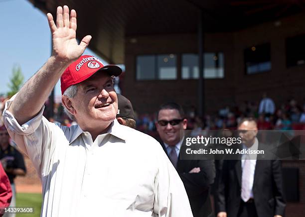 Republican presidential candidate, former Speaker of the House Newt Gingrich waves to the crowd prior to throwing out the first pitch at a baseball...