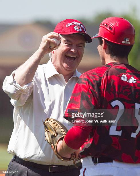 Republican presidential candidate, former Speaker of the House Newt Gingrich laughs with Gardner-Webb University baseball player Chris Rubessa after...