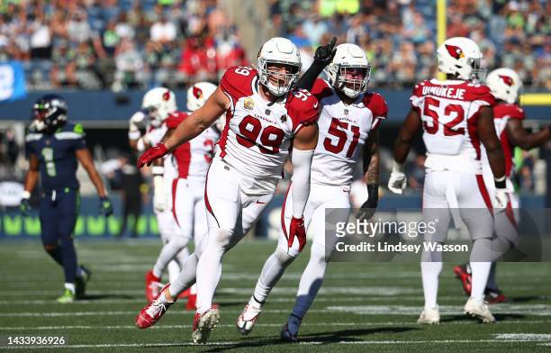 Watt of the Arizona Cardinals celebrates a tackle against the Seattle Seahawks during the second quarter at Lumen Field on October 16, 2022 in...